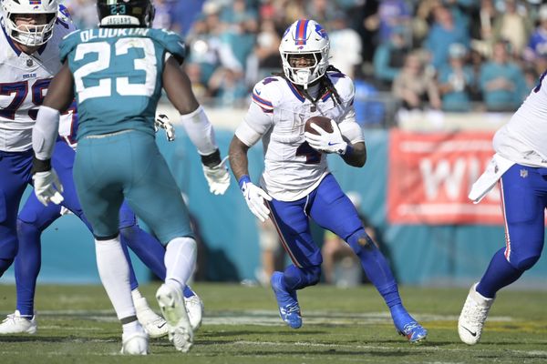 Jan 11, 2026; Jacksonville, FL, USA; Buffalo Bills running back James Cook III (4) carries the ball during the second half against the Jacksonville Jaguars in an AFC Wild Card Round game at EverBank Stadium. Mandatory Credit: Melina Myers-Imagn Images
