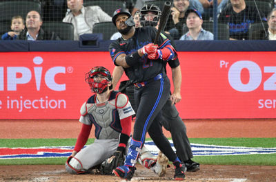 Sep 25, 2024; Toronto, Ontario, CAN;  Toronto Blue Jays first baseman Vladimir Guerrero Jr. (27) hits a double against the Boston Red Sox in the fourth inning at Rogers Centre. Mandatory Credit: Dan Hamilton-Imagn Images