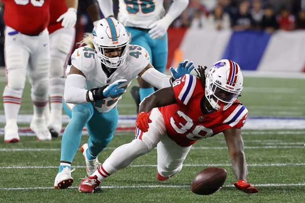 FOXBOROUGH, MA - SEPTEMBER 17: New England Patriots running back Rhamondre Stevenson (38) and Miami Dolphins linebacker Duke Riley (45) chase a fumble during a game between the New England Patriots and the Miami Dolphins on September 17, 2023, at Gillette Stadium in Foxborough, Massachusetts. (Photo by Fred Kfoury III/Icon Sportswire)