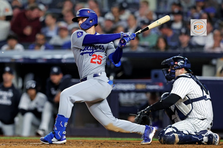 Oct 30, 2024; New York, New York, USA; Los Angeles Dodgers outfielder Tommy Edman (25) breaks his bat while hitting a single during the eighth inning against the New York Yankees in game four of the 2024 MLB World Series at Yankee Stadium. Credit: Brad Penner-Imagn Images