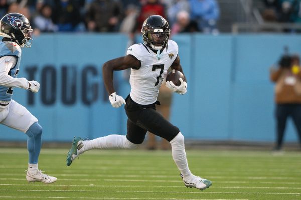 Nov 30, 2025; Nashville, Tennessee, USA;  Jacksonville Jaguars wide receiver Brian Thomas Jr. (7) runs with the ball after a made catch against the Tennessee Titans during the second half at Nissan Stadium. Mandatory Credit: Steve Roberts-Imagn Images