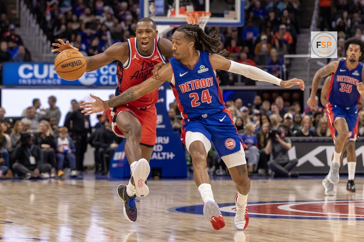 Jan 10, 2026; Detroit, Michigan, USA; Detroit Pistons guard Daniss Jenkins (24) defends against LA Clippers guard Kris Dunn (8) during the second half at Little Caesars Arena. Credit: David Reginek-Imagn Images