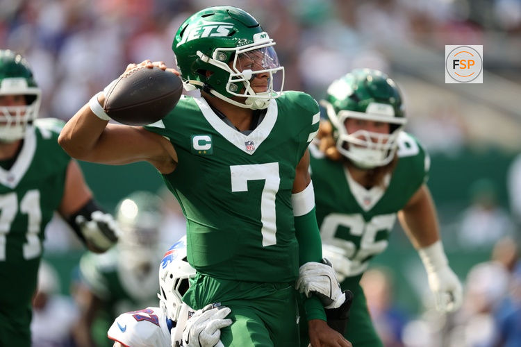 Sep 14, 2025; East Rutherford, New Jersey, USA; New York Jets quarterback Justin Fields (7) is pressured by Buffalo Bills defensive end Joey Bosa (97) during the second half at MetLife Stadium. Credit: Vincent Carchietta-Imagn Images