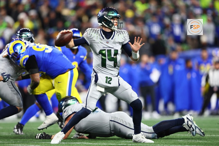 Dec 18, 2025; Seattle, Washington, USA; Seattle Seahawks quarterback Sam Darnold (14) throws a pass against the Los Angeles Rams in the second half at Lumen Field. Credit: Kevin Ng-Imagn Images