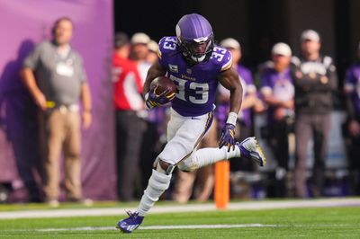 Oct 4, 2026; Minneapolis, Minnesota, USA;  Minnesota Vikings running back Aaron Jones (33) runs after making a catch during the second quarter against the Miami Dolphins at U.S. Bank Stadium.  Mandatory Credit: Brad Rempel-Imagn Images
