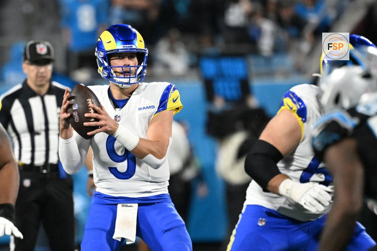 Jan 10, 2026; Charlotte, NC, USA; Los Angeles Rams quarterback Matthew Stafford (9) looks to pass in the third quarter in an NFC Wild Card Round game at Bank of America Stadium. Credit: Bob Donnan-Imagn Images