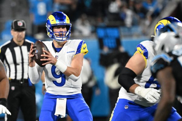 Jan 10, 2026; Charlotte, NC, USA; Los Angeles Rams quarterback Matthew Stafford (9) looks to pass in the third quarter in an NFC Wild Card Round game at Bank of America Stadium. Mandatory Credit: Bob Donnan-Imagn Images