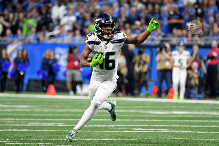 Sep 30, 2024; Detroit, Michigan, USA; Seattle Seahawks wide receiver Tyler Lockett (16) runs the ball against the Detroit Lions in the third quarter at Ford Field. Credit: Eamon Horwedel-Imagn Images