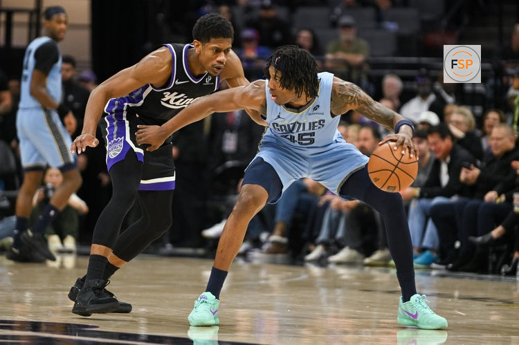 Feb 4, 2026; Sacramento, California, USA; Memphis Grizzlies forward GG Jackson (45) dribbles against Sacramento Kings forward De’Andre Hunter (15) during the fourth quarter at Golden 1 Center. Credit: Ed Szczepanski-Imagn Images