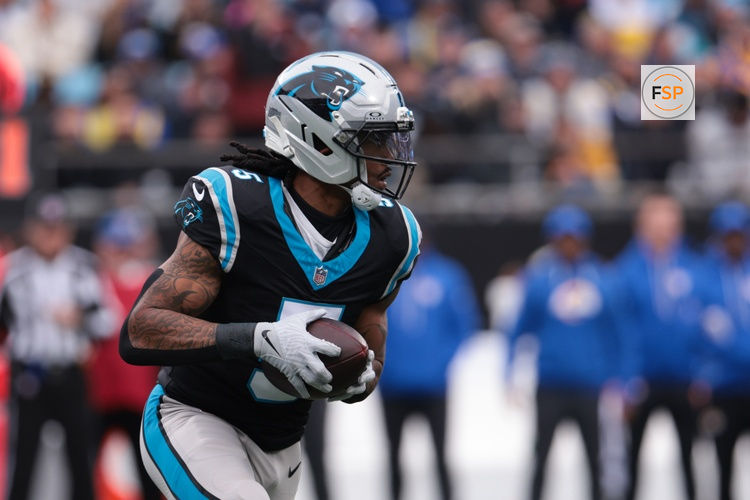 Nov 30, 2025; Charlotte, North Carolina, USA; Carolina Panthers running back Rico Dowdle (5) rushes during the first quarter against the Los Angeles Rams at Bank of America Stadium. Credit: Scott Kinser-Imagn Images