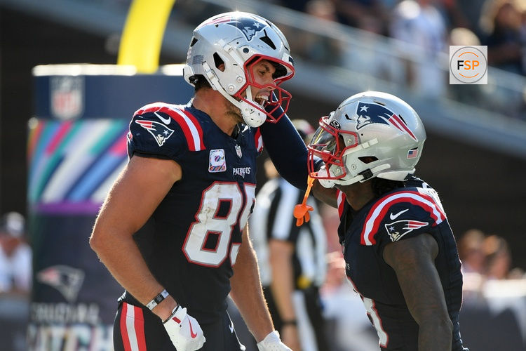 Sep 28, 2025; Foxborough, Massachusetts, USA; New England Patriots tight end Hunter Henry (85) reacts with wide receiver Stefon Diggs (8) after scoring a touchdown during the second half at Gillette Stadium. Credit: Bob DeChiara-Imagn Images