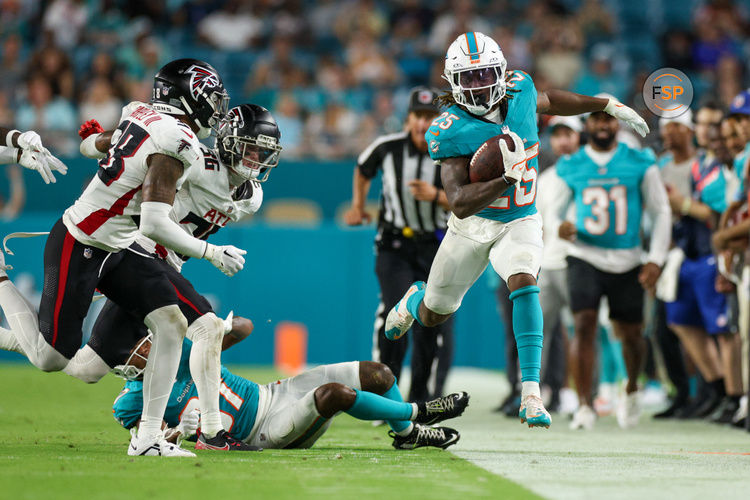 Aug 9, 2024; Miami Gardens, Florida, USA; Miami Dolphins running back Jaylen Wright (25) runs down the sideline against the Atlanta Falcons in the third quarter during preseason at Hard Rock Stadium. Credit: Nathan Ray Seebeck-USA TODAY Sports