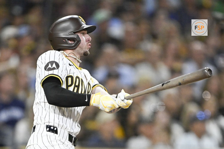Aug 19, 2024; San Diego, California, USA; San Diego Padres center fielder Jackson Merrill (3) hits an RBI double during the third inning against the Minnesota Twins at Petco Park. Credit: Denis Poroy-USA TODAY Sports