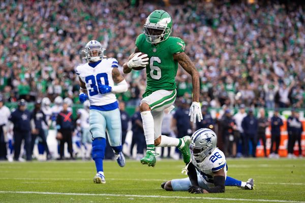Dec 29, 2024; Philadelphia, Pennsylvania, USA; Philadelphia Eagles wide receiver DeVonta Smith (6) runs past Dallas Cowboys cornerback DaRon Bland (26) for a touchdown after a catch during the fourth quarter at Lincoln Financial Field. Mandatory Credit: Bill Streicher-Imagn Images