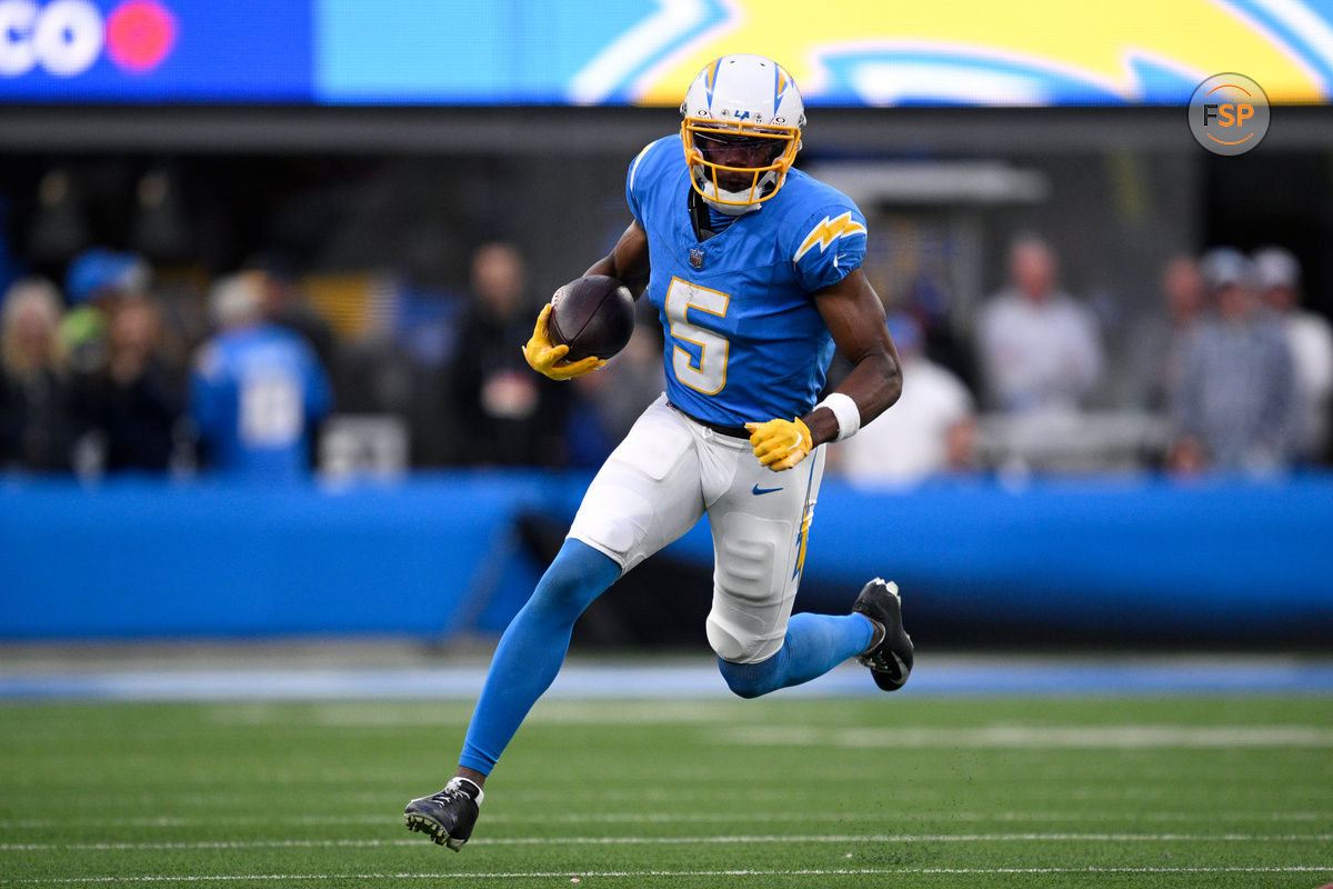 Jan 7, 2024; Inglewood, California, USA; Los Angeles Chargers wide receiver Joshua Palmer (5) runs with the ball during the second half against the Kansas City Chiefs at SoFi Stadium. Credit: Orlando Ramirez-USA TODAY Sports