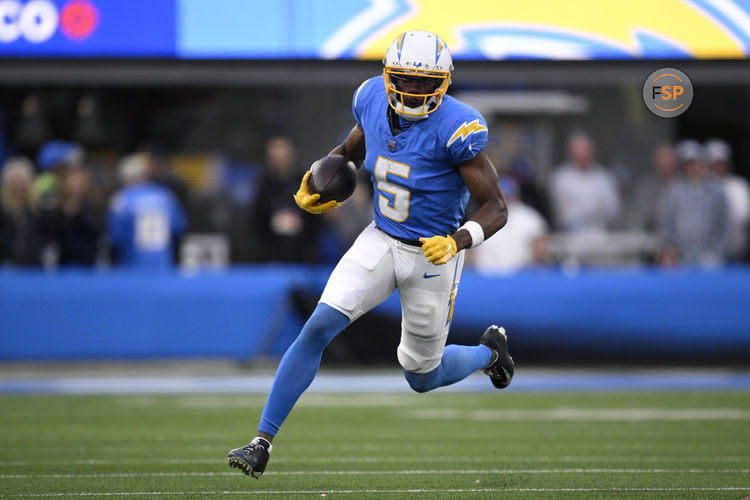 Jan 7, 2024; Inglewood, California, USA; Los Angeles Chargers wide receiver Joshua Palmer (5) runs with the ball during the second half against the Kansas City Chiefs at SoFi Stadium. Credit: Orlando Ramirez-USA TODAY Sports