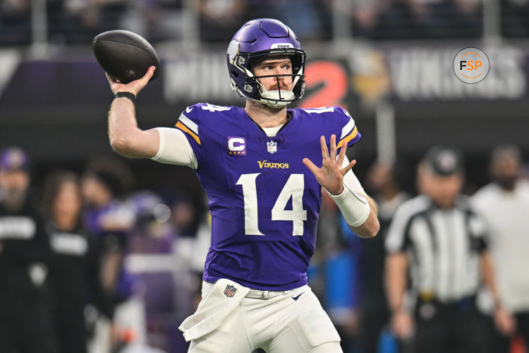 Dec 29, 2024; Minneapolis, Minnesota, USA; Minnesota Vikings quarterback Sam Darnold (14) throws a pass against the Green Bay Packers during the first quarter at U.S. Bank Stadium. Credit: Jeffrey Becker-Imagn Images