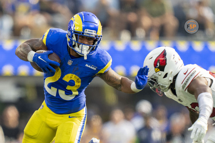 October 15, 2023; Inglewood, California, USA; Los Angeles Rams running back Kyren Williams (23) runs the football against Arizona Cardinals cornerback Marco Wilson (20) during the third quarter at SoFi Stadium. Credit: Kyle Terada-USA TODAY Sports