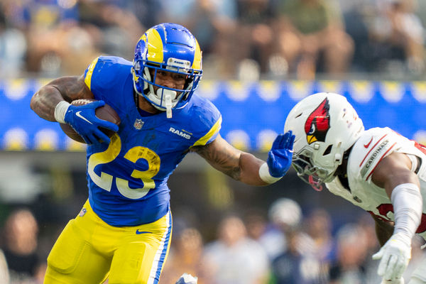 October 15, 2023; Inglewood, California, USA; Los Angeles Rams running back Kyren Williams (23) runs the football against Arizona Cardinals cornerback Marco Wilson (20) during the third quarter at SoFi Stadium. Mandatory Credit: Kyle Terada-USA TODAY Sports