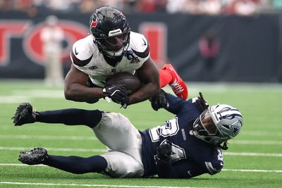 Oct 4, 2026; Houston, Texas, USA;  Houston Texans running back Woody Marks (4) is tackled Dallas Cowboys safety Malik Hooker (24) during the second half at Reliant Stadium.  Mandatory Credit: Troy Taormina-Imagn Images     TPX IMAGES OF THE DAY     