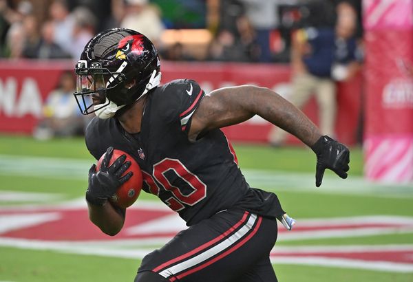 Oct 5, 2025; Glendale, Arizona, USA; Arizona Cardinals running back Bam Knight (20) returns a kickoff against the Tennessee Titans during the fourth quarter at State Farm Stadium. Mandatory Credit: Matt Kartozian-Imagn Images