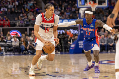 Mar 11, 2025; Detroit, Michigan, USA; Detroit Pistons guard Dennis Schroder (17) defends against Washington Wizards forward Kyshawn George (18) during the first half at Little Caesars Arena. Mandatory Credit: David Reginek-Imagn Images