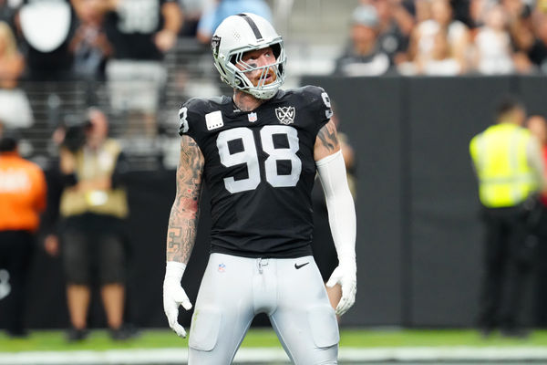 Sep 22, 2024; Paradise, Nevada, USA; Las Vegas Raiders defensive end Maxx Crosby (98) celebrates after getting a sack against the Carolina Panthers during the second quarter at Allegiant Stadium. Mandatory Credit: Stephen R. Sylvanie-Imagn Images