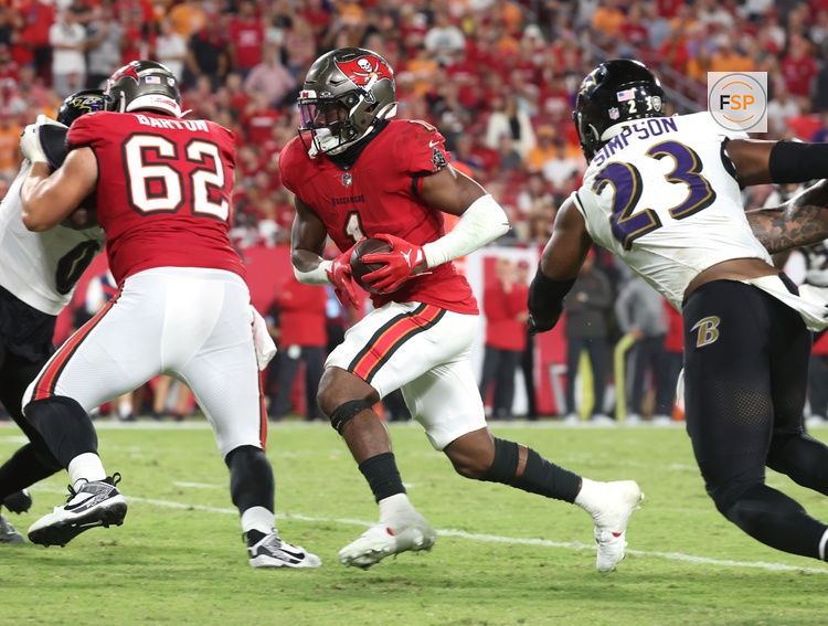 Oct 21, 2024; Tampa, Florida, USA; Tampa Bay Buccaneers running back Rachaad White (1) runs the ball for a touchdown against the Baltimore Ravens during the second half at Raymond James Stadium. Credit: Kim Klement Neitzel-Imagn Images