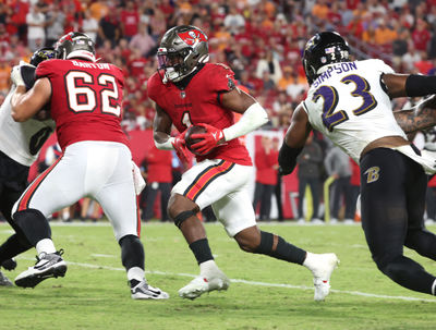 Oct 21, 2024; Tampa, Florida, USA; Tampa Bay Buccaneers running back Rachaad White (1) runs the ball for a touchdown against the Baltimore Ravens during the second half at Raymond James Stadium. Mandatory Credit: Kim Klement Neitzel-Imagn Images