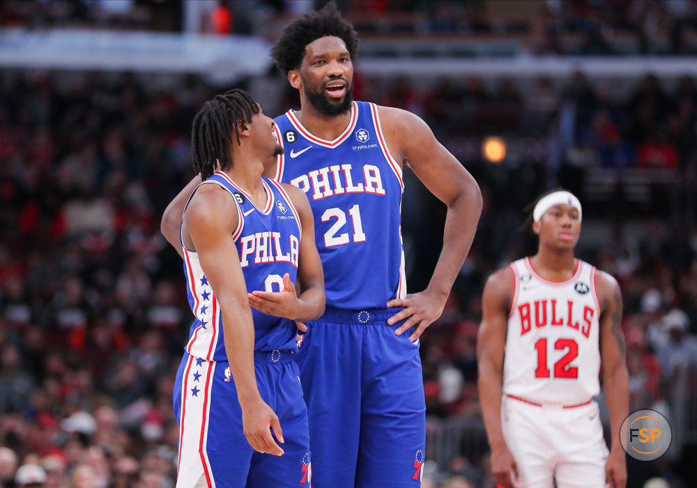 CHICAGO, IL - MARCH 22: Philadelphia 76ers guard Tyrese Maxey (0) and Philadelphia 76ers center Joel Embiid (21) chat during a NBA game between the Philadelphia 76ers and the Chicago Bulls on March 22, 2023 at the United Center in Chicago, IL. (Photo by Melissa Tamez/Icon Sportswire)