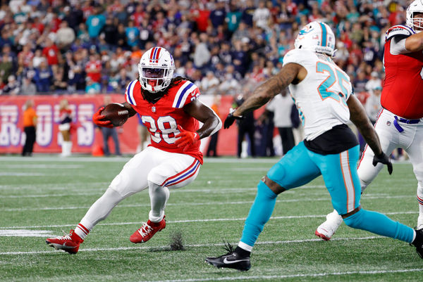 FOXBOROUGH, MA - SEPTEMBER 17: New England Patriots running back Rhamondre Stevenson (38) carries around end during a game between the New England Patriots and the Miami Dolphins on September 17, 2023, at Gillette Stadium in Foxborough, Massachusetts. (Photo by Fred Kfoury III/Icon Sportswire)