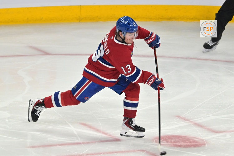 May 27, 2026; Montreal, Quebec, CAN; Montreal Canadiens right wing Cole Caufield (13) shoots the puck against the Carolina Hurricanes during the second period in game four of the Eastern Conference Final of the 2026 Stanley Cup Playoffs at Bell Centre. Credit: Eric Bolte-Imagn Images