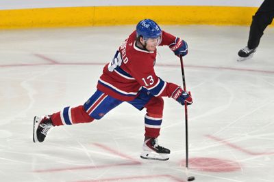 May 27, 2026; Montreal, Quebec, CAN; Montreal Canadiens right wing Cole Caufield (13) shoots the puck against the Carolina Hurricanes during the second period in game four of the Eastern Conference Final of the 2026 Stanley Cup Playoffs at Bell Centre. Mandatory Credit: Eric Bolte-Imagn Images