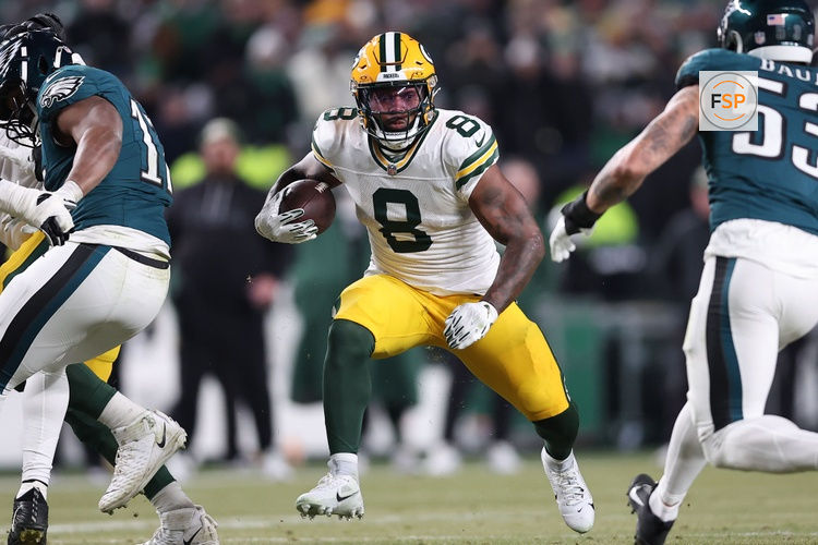 Jan 12, 2025; Philadelphia, Pennsylvania, USA; Green Bay Packers running back Josh Jacobs (8) rushes the ball against the Philadelphia Eagles during the first half in an NFC wild card game at Lincoln Financial Field. Credit: Bill Streicher-Imagn Images