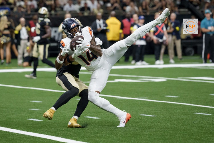 Aug 23, 2025; New Orleans, Louisiana, USA; Denver Broncos wide receiver Courtland Sutton (14) makes a touchdown reception against New Orleans Saints safety Julian Blackmon (28) during the first half at Caesars Superdome. Credit: Matthew Hinton-Imagn Images