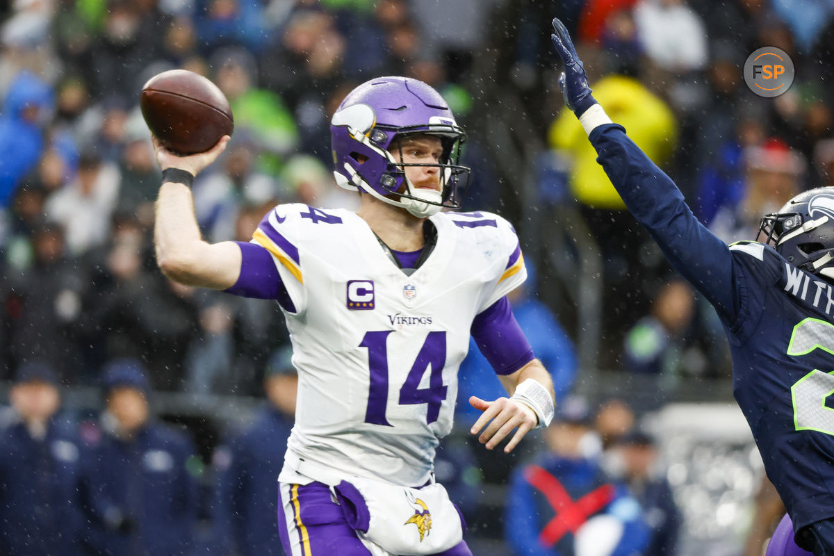 Dec 22, 2024; Seattle, Washington, USA; Minnesota Vikings quarterback Sam Darnold (14) passes against the Seattle Seahawks during the second quarter at Lumen Field. Credit: Joe Nicholson-Imagn Images