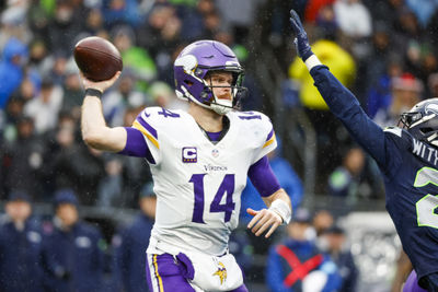 Dec 22, 2024; Seattle, Washington, USA; Minnesota Vikings quarterback Sam Darnold (14) passes against the Seattle Seahawks during the second quarter at Lumen Field. Mandatory Credit: Joe Nicholson-Imagn Images