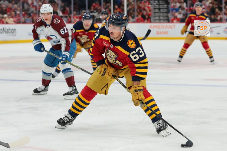 Jan 4, 2026; Sunrise, Florida, USA; Florida Panthers left wing Brad Marchand (63) moves the puck against the Colorado Avalanche during the first period at Amerant Bank Arena. Credit: Sam Navarro-Imagn Images