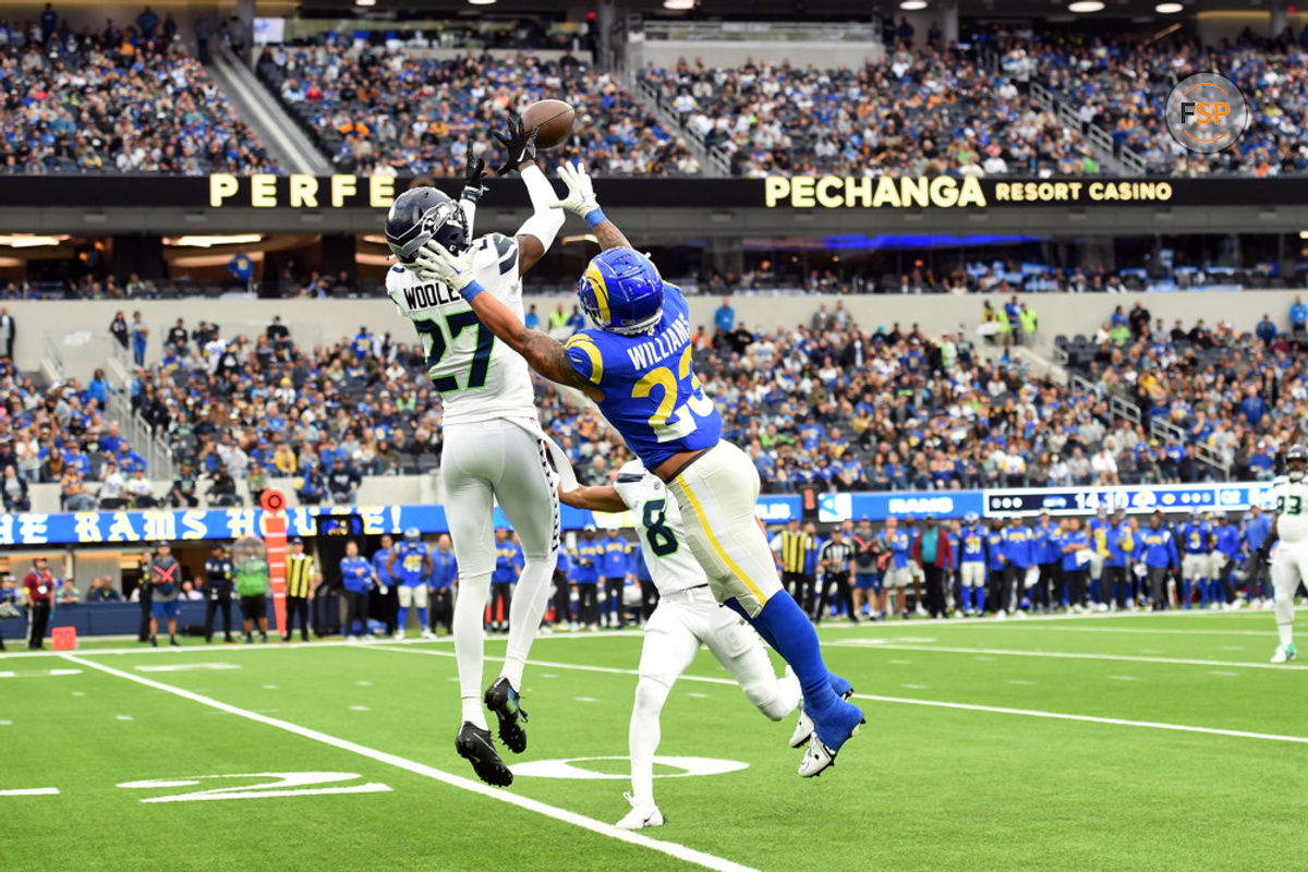 INGLEWOOD, CA - DECEMBER 04: Seattle Seahawks cornerback Tariq Woolen (27) catches a pass for an interception against Los Angeles Rams running back Kyren Williams (23) during an NFL game between the Seattle Seahawks and the Los Angeles Rams on December 04, 2022, at SoFi Stadium in Inglewood, CA. (Photo by Chris Williams/Icon Sportswire)