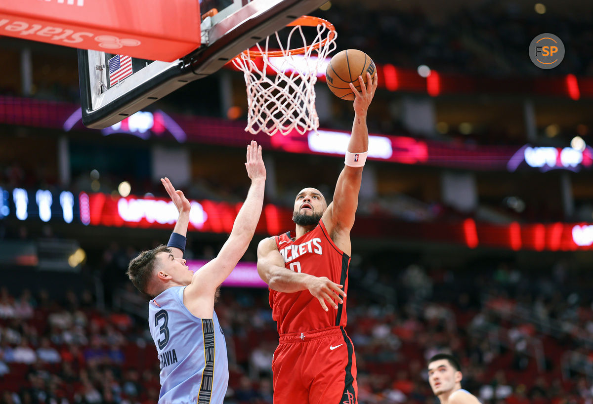 Oct 25, 2024; Houston, Texas, USA; Houston Rockets forward Dillon Brooks (9) shoots the ball as Memphis Grizzlies forward Jake LaRavia (3) defends during the fourth quarter at Toyota Center. Credit: Troy Taormina-Imagn Images