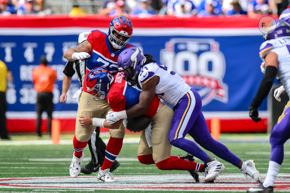 Sep 8, 2024; East Rutherford, New Jersey, USA; Minnesota Vikings linebacker Pat Jones II (91) sacks New York Giants quarterback Daniel Jones (8) during the second half at MetLife Stadium. Credit: John Jones-Imagn Images