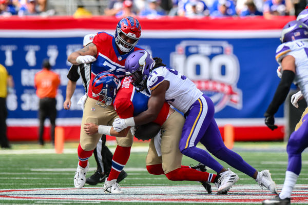 Sep 8, 2024; East Rutherford, New Jersey, USA; Minnesota Vikings linebacker Pat Jones II (91) sacks New York Giants quarterback Daniel Jones (8) during the second half at MetLife Stadium. Mandatory Credit: John Jones-Imagn Images