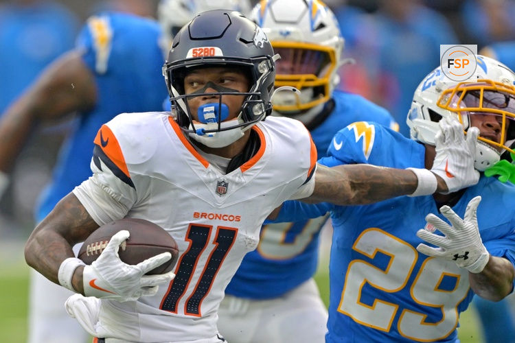 Sep 21, 2025; Inglewood, California, USA; Denver Broncos wide receiver Troy Franklin (11) pushes off Los Angeles Chargers cornerback Tarheeb Still (29) as he runs the ball in the second half at SoFi Stadium. Credit: Jayne Kamin-Oncea-Imagn Images