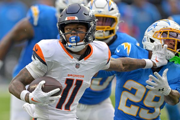 Sep 21, 2025; Inglewood, California, USA; Denver Broncos wide receiver Troy Franklin (11) pushes off Los Angeles Chargers cornerback Tarheeb Still (29) as he runs the ball in the second half at SoFi Stadium. Mandatory Credit: Jayne Kamin-Oncea-Imagn Images