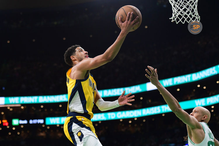 Dec 29, 2024; Boston, Massachusetts, USA; Indiana Pacers guard Tyrese Haliburton (0) drives to the basket while Boston Celtics guard Jordan Walsh (27) defends during the second half at TD Garden. Credit: Bob DeChiara-Imagn Images