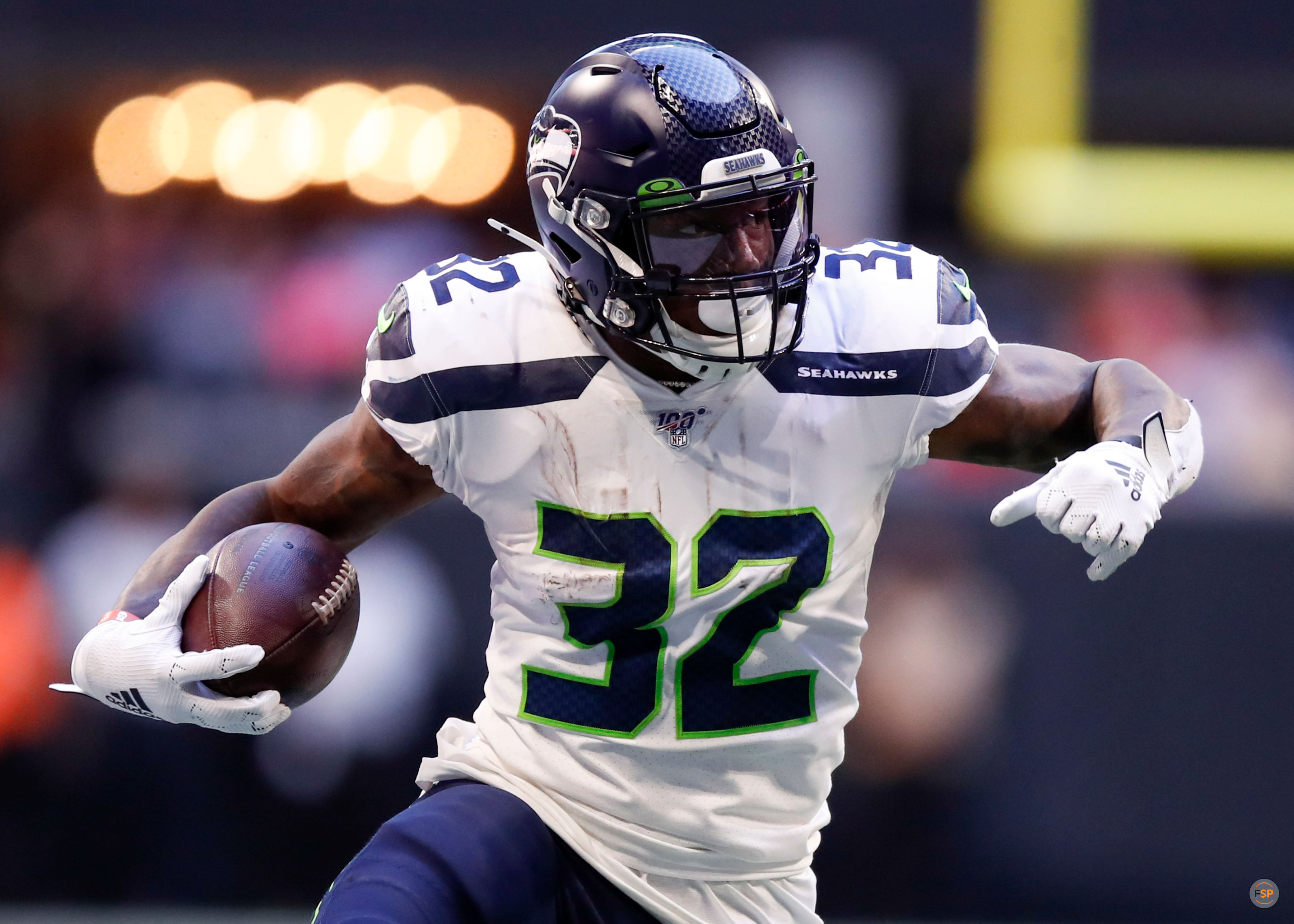 ATLANTA, GA - OCTOBER 27: Chris Carson #32 of the Seattle Seahawks rushes in the first half of an NFL game against the Atlanta Falcons at Mercedes-Benz Stadium on October 27, 2019 in Atlanta, Georgia. (Photo by Todd Kirkland/Getty Images) *** Local Caption *** Chris Carson