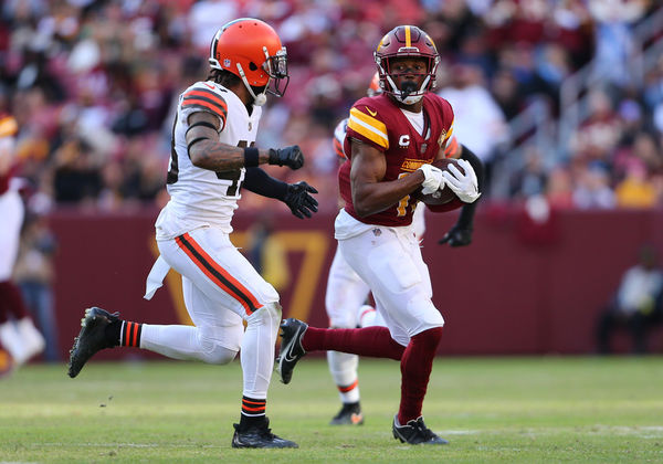 LANDOVER, MD - JANUARY 01: Washington Commanders wide receiver Terry McLaurin (17) hauls in a pass then rushes up field then attempts to elude Cleveland Browns safeties John Johnson III (43) and Grant Delpit (22) during the Cleveland Browns game versus the Washington Commanders on January 01, 2023, at FedEx Field in Landover, MD. (Photo by Lee Coleman/Icon Sportswire)