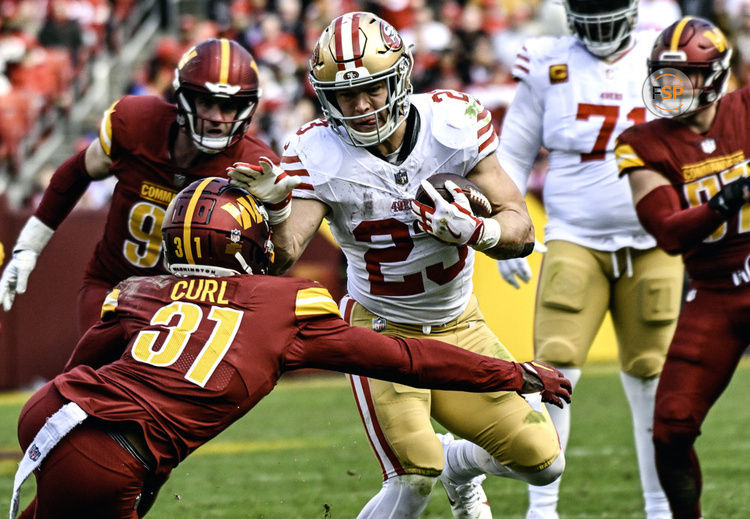 LANDOVER, MD - DECEMBER 31: San Francisco 49ers running back Christian McCaffrey (23) in action against Washington Commanders safety Kamren Curl (31) during the NFL game between the San Francisco 49ers and the Washington Commanders on December 31, 2023 at Fed Ex Field in Landover, MD.  (Photo by Mark Goldman/Icon Sportswire)