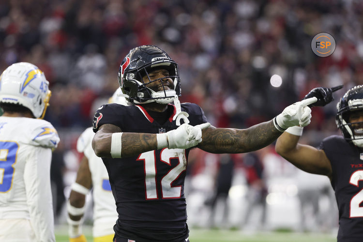 Jan 11, 2025; Houston, Texas, USA;  Houston Texans wide receiver Nico Collins (12) reacts to a first down against the Los Angeles Chargers in the second quarter in an AFC wild card game at NRG Stadium. Credit: Thomas Shea-Imagn Images