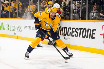  Feb 23, 2025; Nashville, Tennessee, USA;  Nashville Predators center Ryan O'Reilly (90) skates behind the net against the New Jersey Devilsduring the first half at Bridgestone Arena. Mandatory Credit: Steve Roberts-Imagn Images